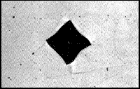 Photo of a distorted Vickers indent.